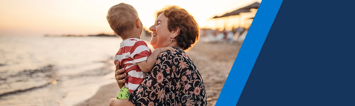 Grandmother and grandchild on a beach
