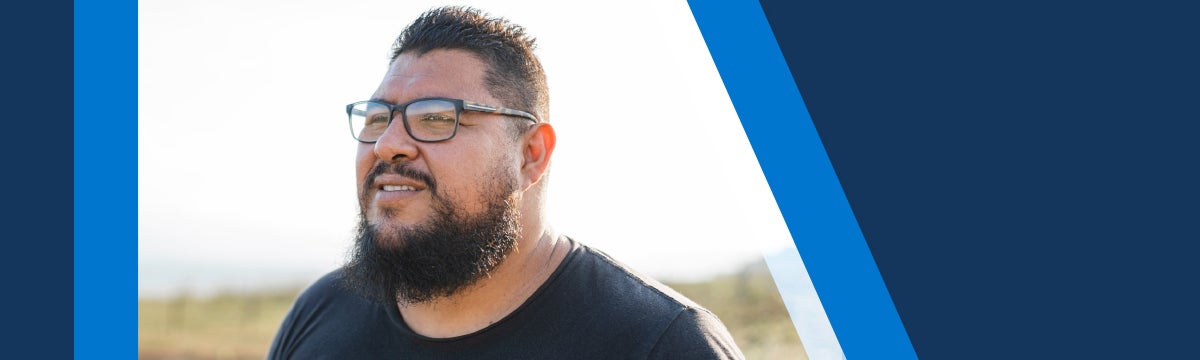 man with glasses smiling