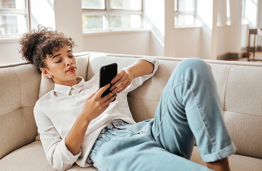 Image of woman looking at cell phone