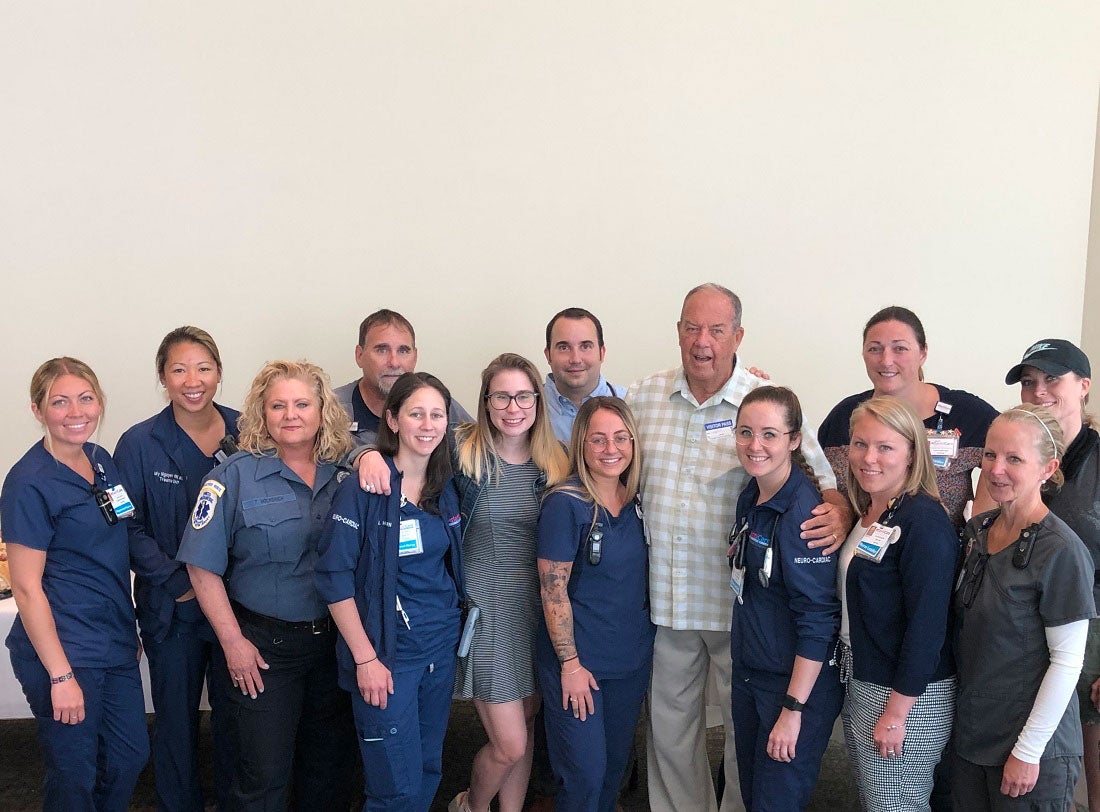 Thomas Richards is surrounded by AtlantiCare staff.