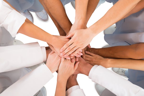 Diverse group of people with hands together
