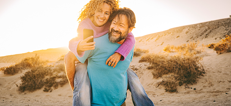 Couple taking a selfie on the beach